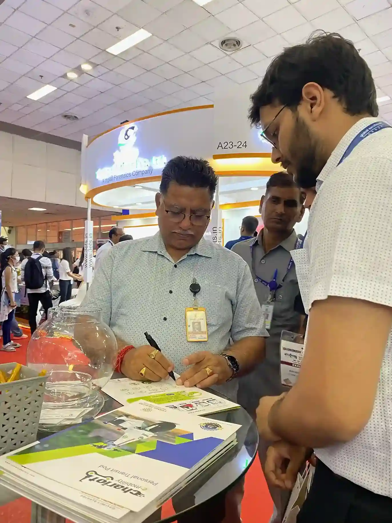 the delegate interacting with the exhibitor